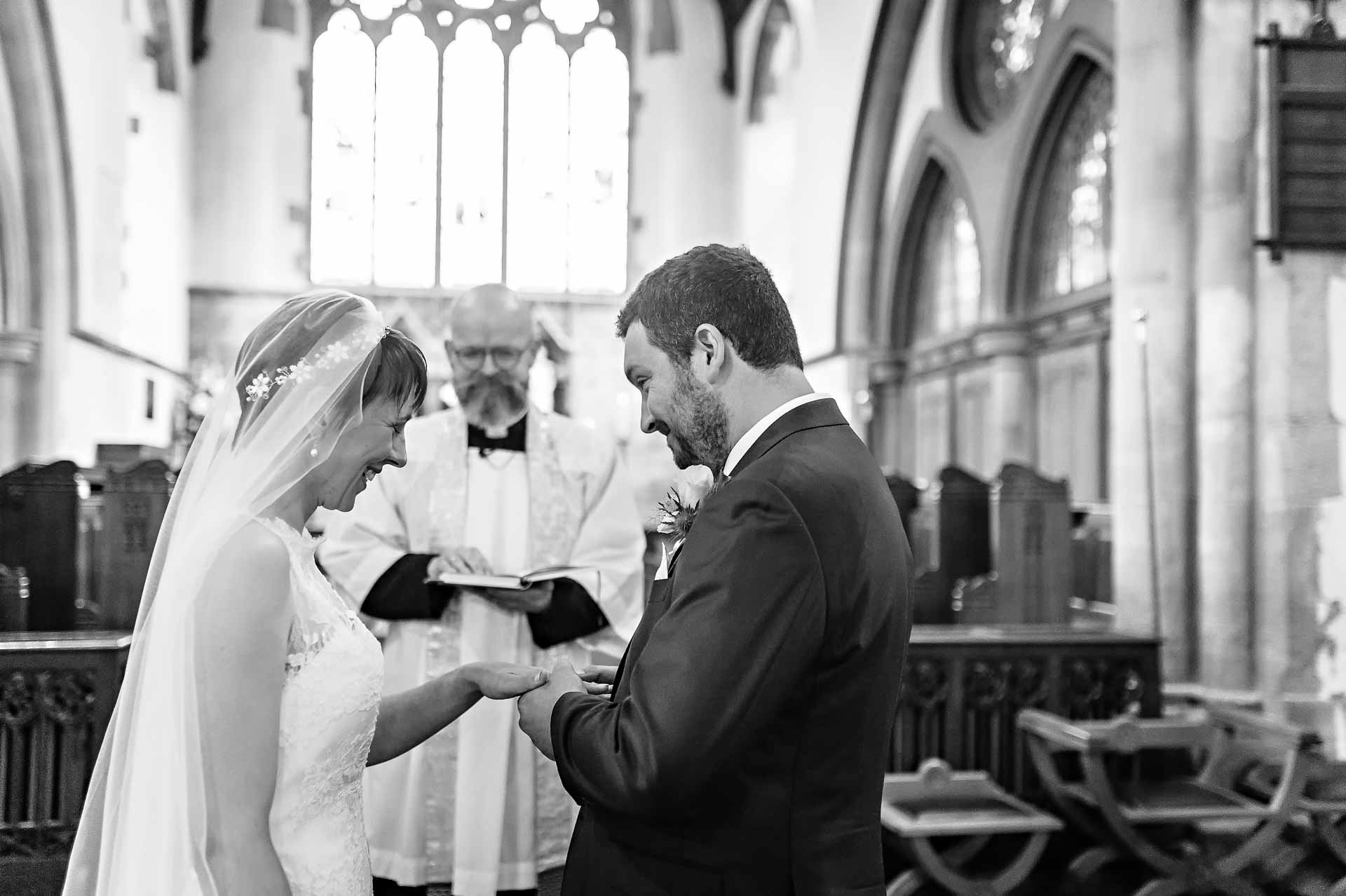 Black and White Wedding Photograph of Exchange of Rings in South Wales Church