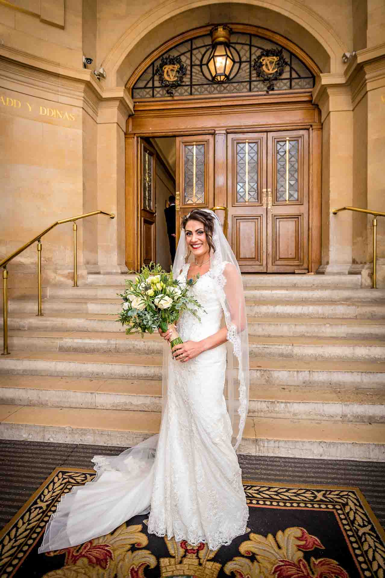 Bride smiling in entrance hall to Cardiff City Hall