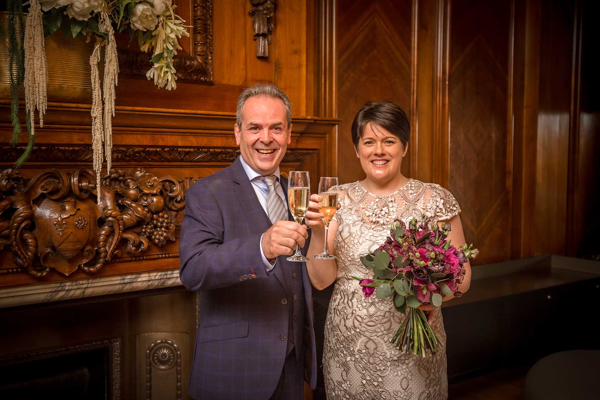 Newly-weds with Champagne at Old Marylebone Town Hall Wedding