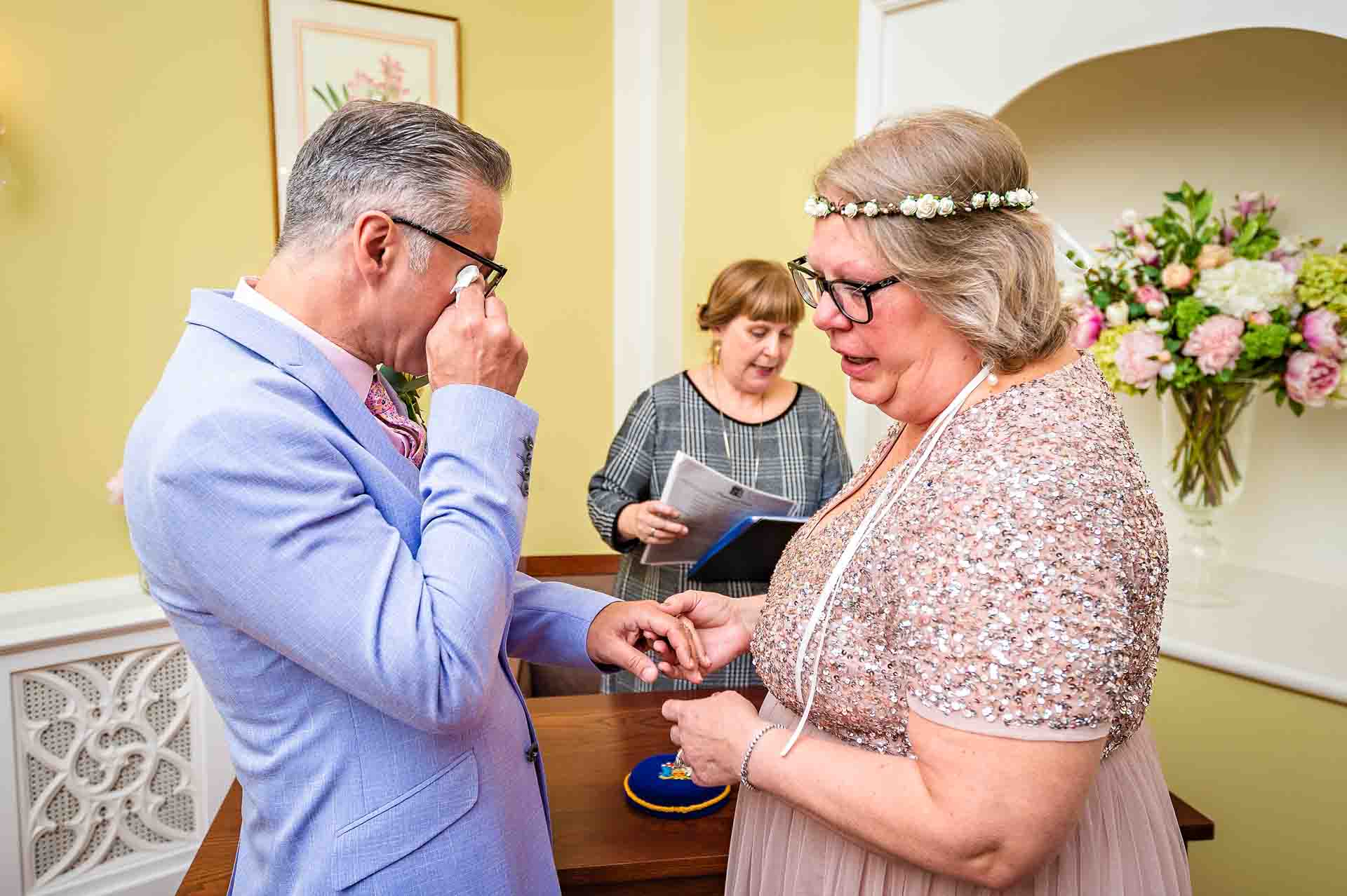 Mature groom crying at wedding in London