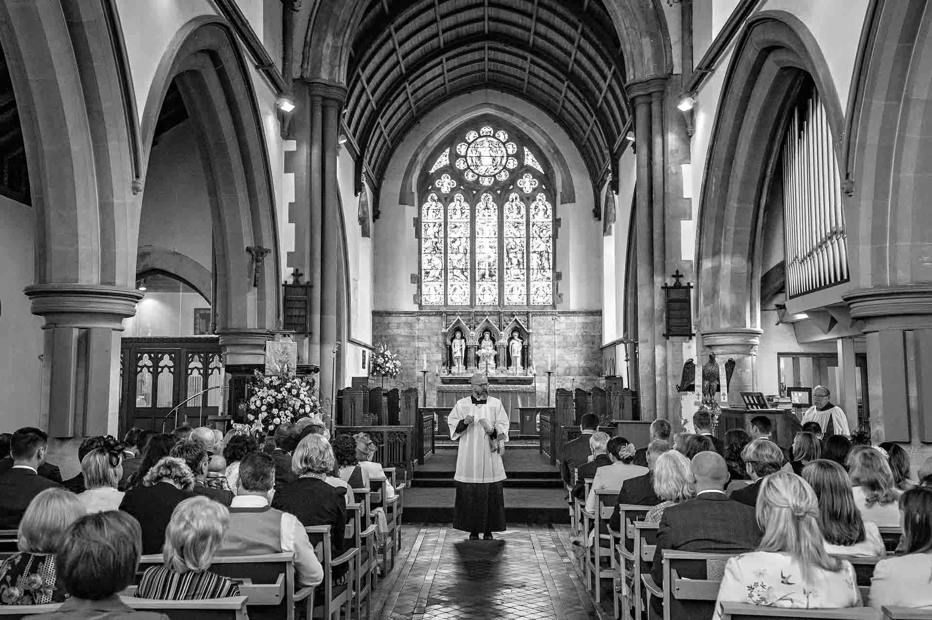 Father Mark talks to congregation at St Martins Church Caerphilly Wedding