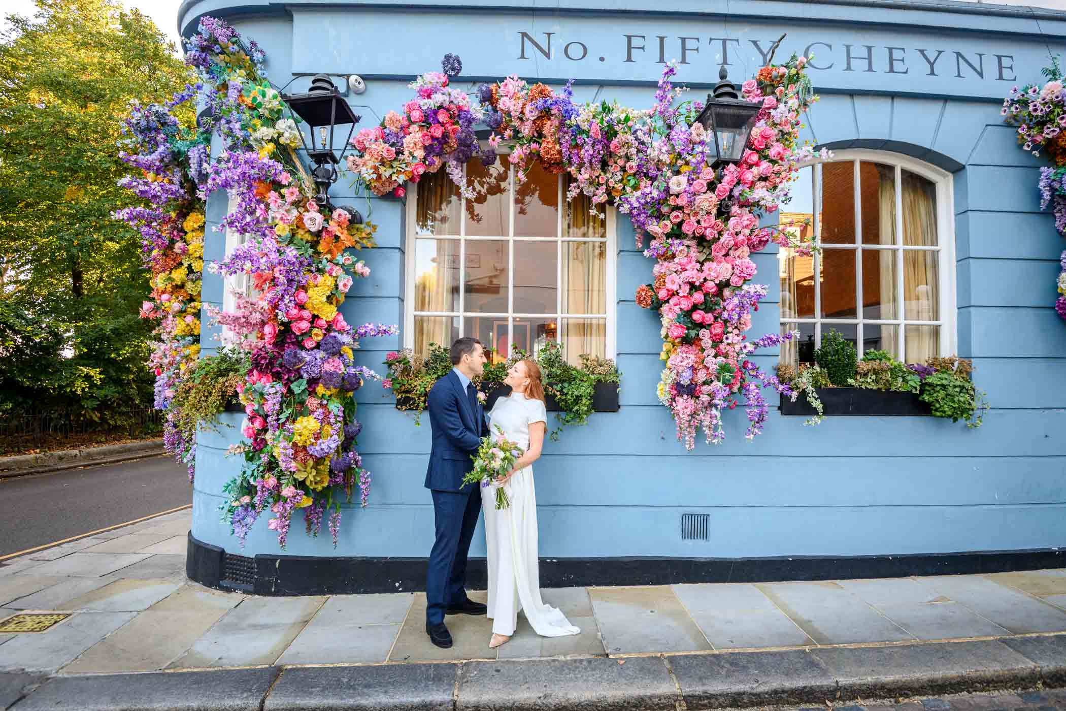 Couple posing outside No. Fifty Cheyne in Chelsea