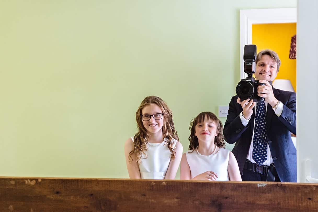 Bridesmaids in Mirror with Photographer Smiling