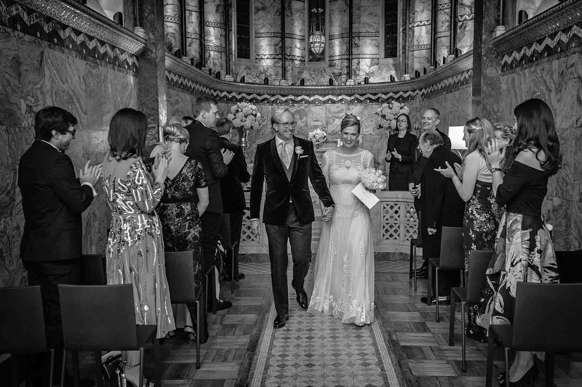 Wedding at Fitzrovia Chapel - Couple Walking Down Aisle Together