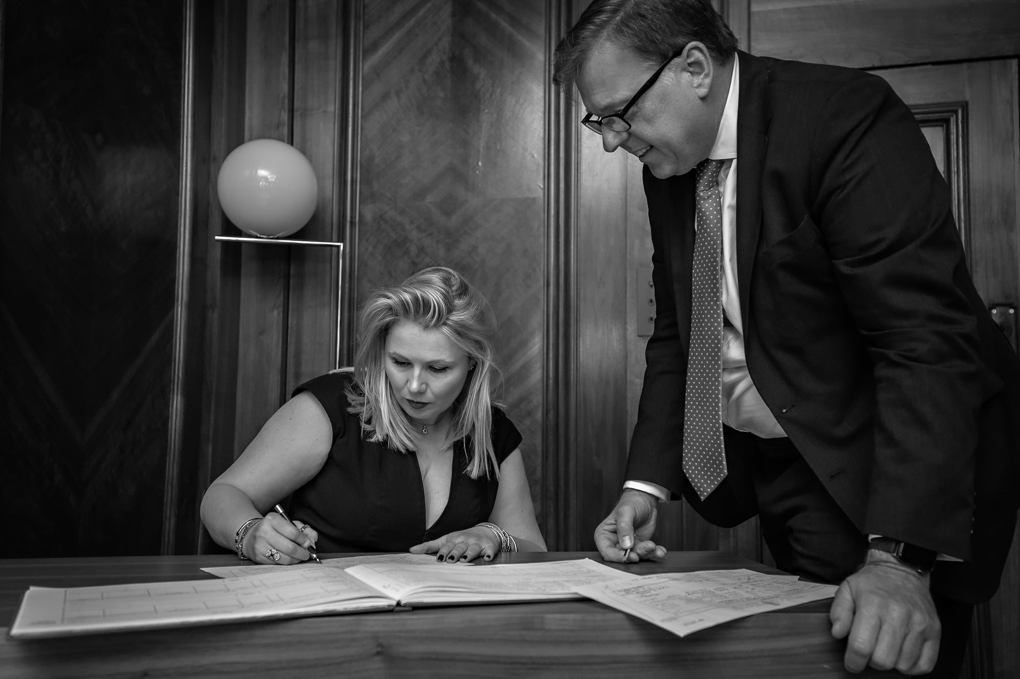 A witness signing the register at Old Marylebone Town Hall wedding