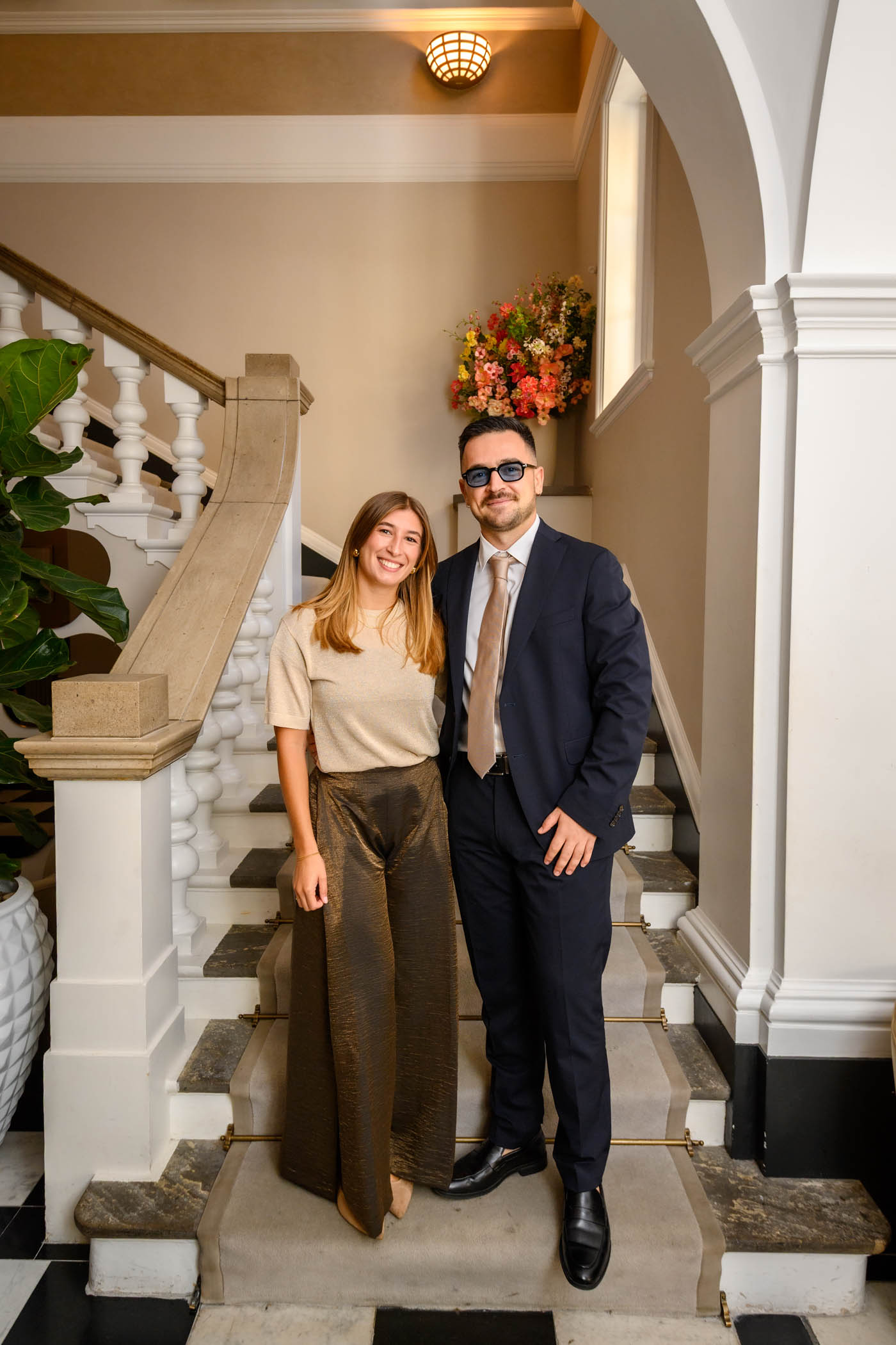 Wedding guests posing on the stairs in the waiting area