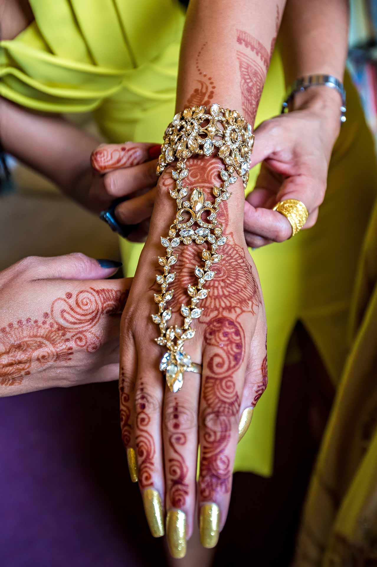 Henna Tattoos on Bride's Arm at Indian Wedding