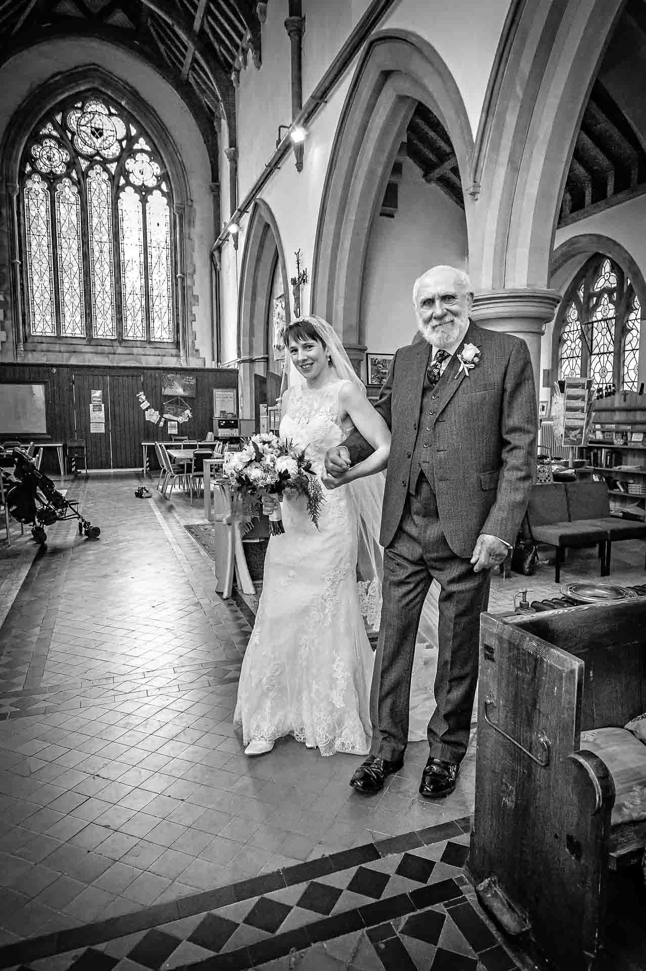 Bride walks down aisle with granddad in Parish of Caerphilly Church