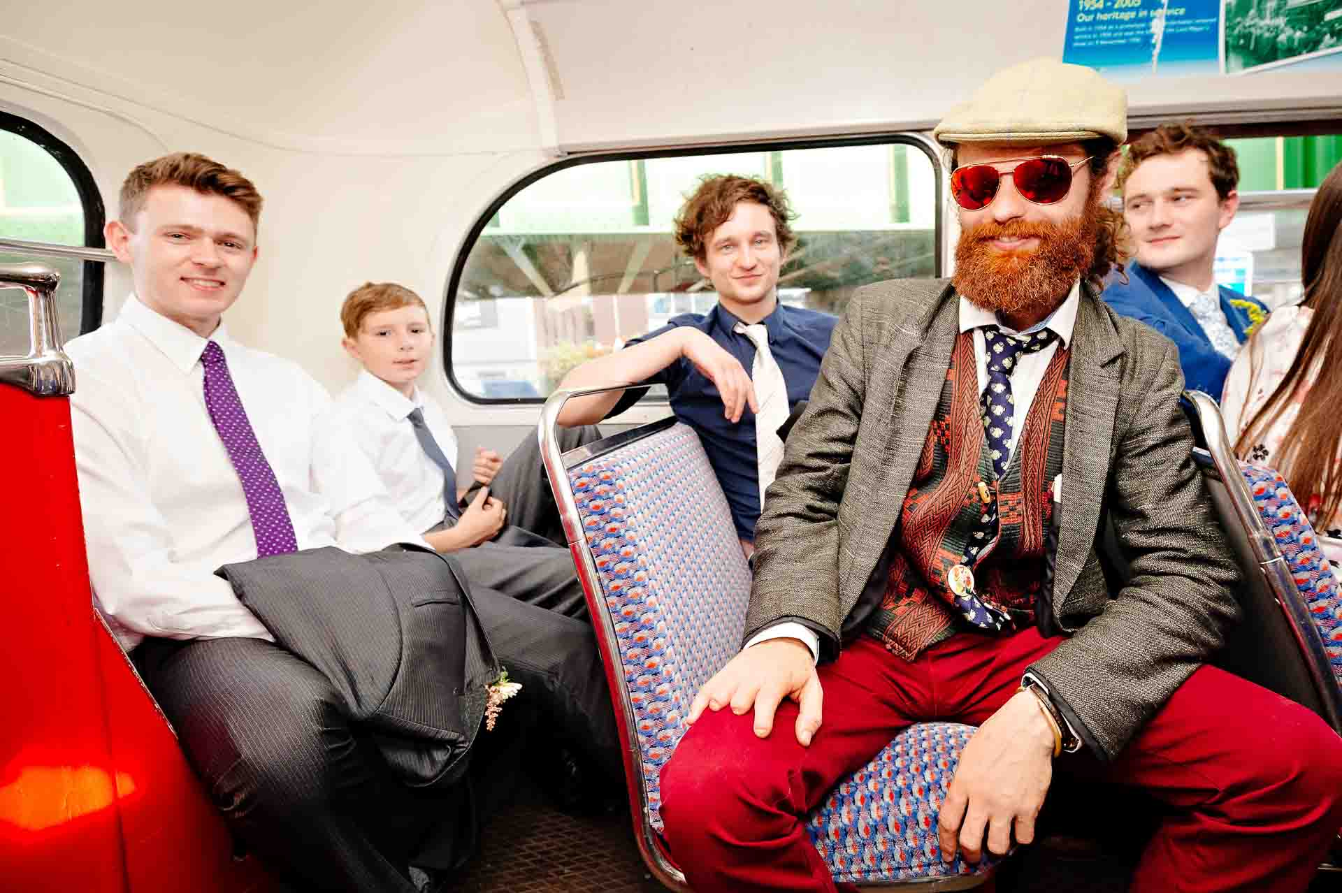 4 man and a boy on top deck of wedding Routemaster bus