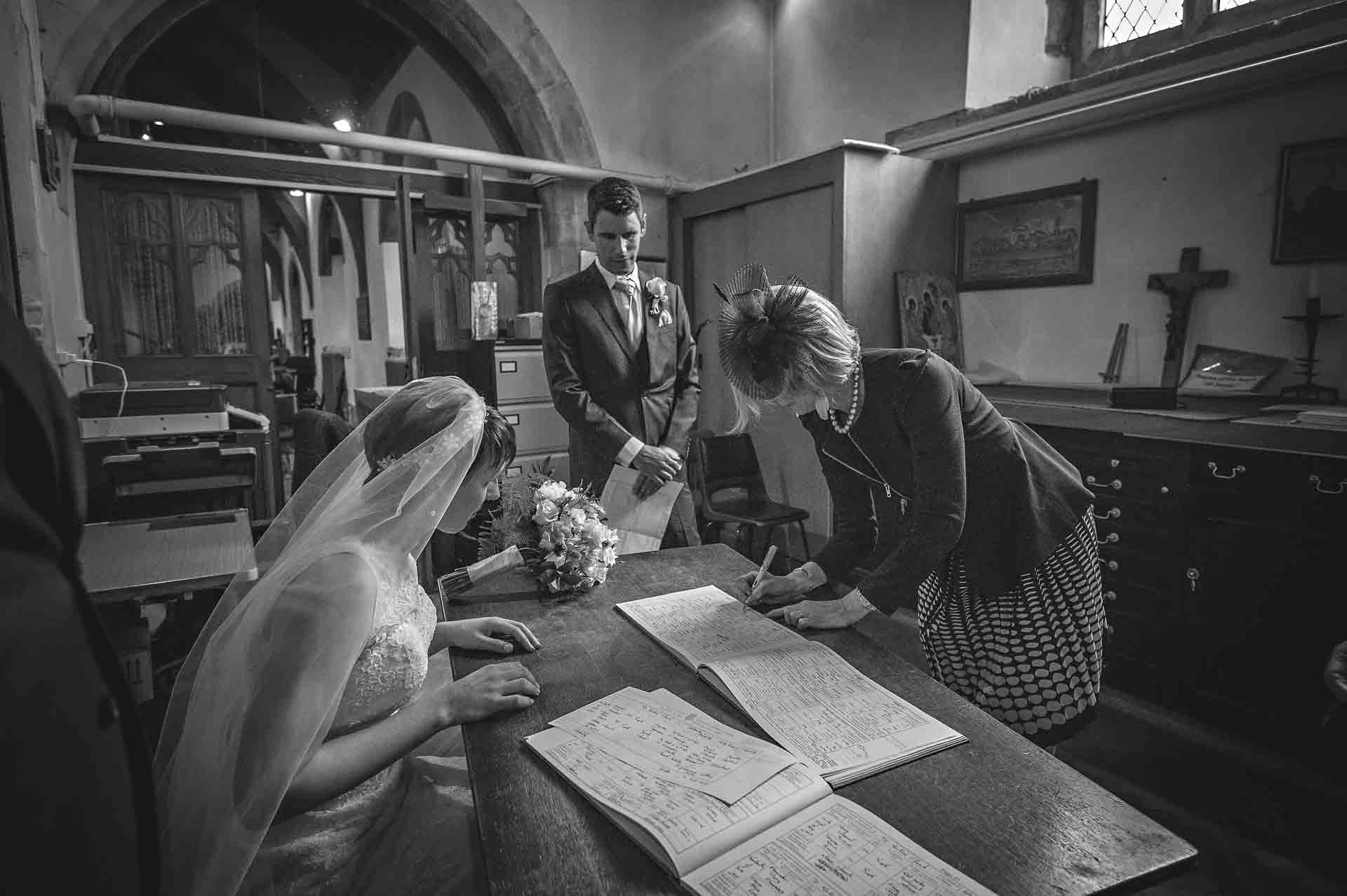 Witness Signing the Welsh Wedding Register in Caerphilly with Bride Watching